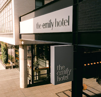 Exterior signage for a boutique hotel entrance